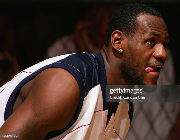 LeBron James of the Cleveland Cavaliers plays basketball with young Chinese players during the Nike 2005 Battlegrounds event August 4, 2005 in...