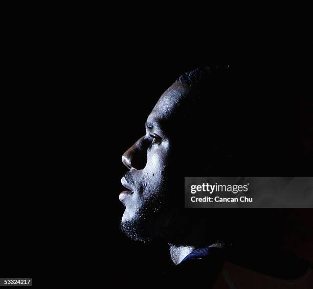 LeBron James of the Cleveland Cavaliers plays basketball with young Chinese players during the Nike 2005 Battlegrounds event August 4, 2005 in...