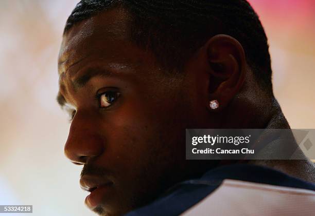 LeBron James of the Cleveland Cavaliers plays basketball with young Chinese players during the Nike 2005 Battlegrounds event August 4, 2005 in...