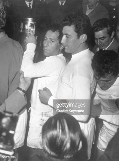 Real Madrid, no.10, Francisco Gento L?pez with the European Cup after his team had beaten Partiz Belgrade 2-1 in the final in Brussels, 11th May 1966.