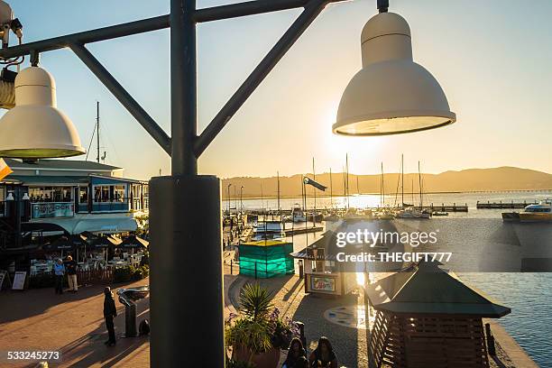 knysna kai waterfront silhouette - knysna stock-fotos und bilder