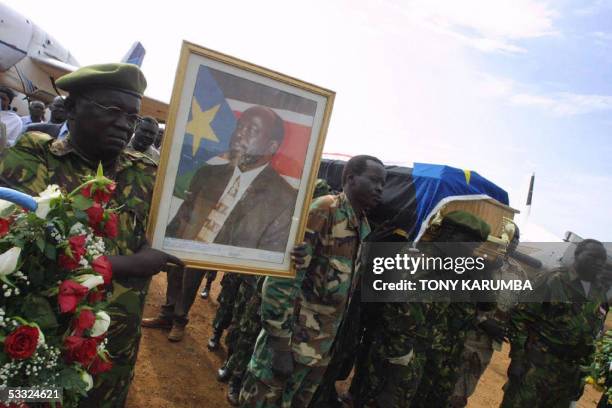 The coffin containing the body of the late Sudan Vice-President, John Garang is marched to be loaded onto a plane at Kurmuk 04 August 2005. The...