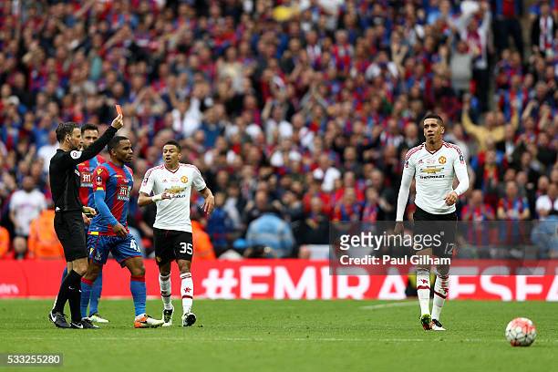 Chris Smalling of Manchester United is sent off by referee Mark Clattenburg after a second booking during The Emirates FA Cup Final match between...