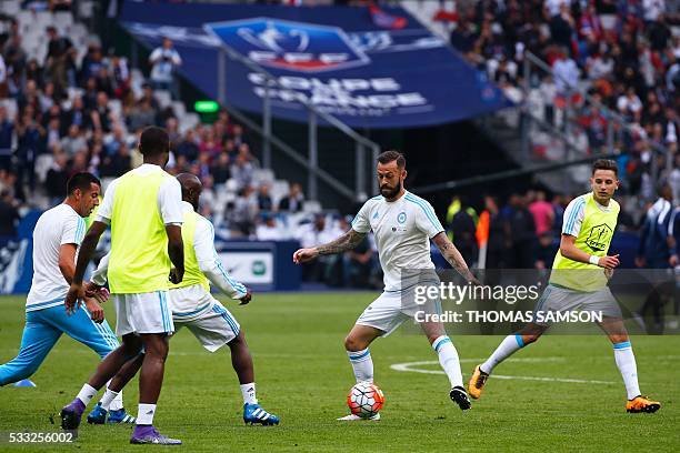 Marseille's Scottish forward Steven Fletcher warms up with teammates prior to the French Cup final football match beween Marseille and Paris...