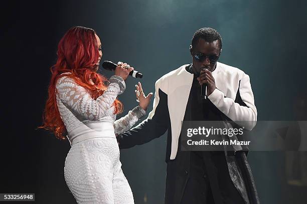 Faith and Sean "Diddy" Combs aka Puff Daddy perform onstage during the Puff Daddy and The Family Bad Boy Reunion Tour presented by Ciroc Vodka And...
