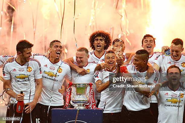 Manchester United players celebrate victory with the trophy after The Emirates FA Cup Final match between Manchester United and Crystal Palace at...