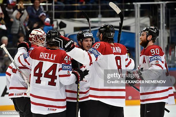 Canada's players celebrate after winning the semifinal game Canada vs USA at the 2016 IIHF Ice Hockey World Championship in Moscow on May 21, 2016. /...