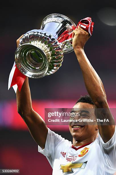 Jesse Lingard of Manchester United lifts the trophy after The Emirates FA Cup Final match between Manchester United and Crystal Palace at Wembley...