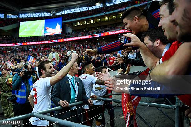 Juan Mata of Manchester United celebrates victory with the fans after The Emirates FA Cup Final match between Manchester United and Crystal Palace at...