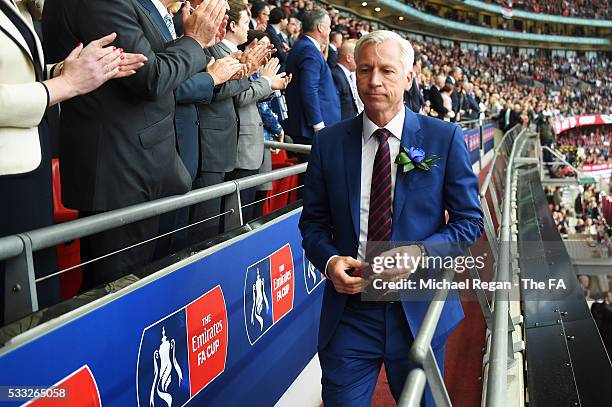 Alan Pardew Manager of Crystal Palace receives the runners-up medal during The Emirates FA Cup Final match between Manchester United and Crystal...
