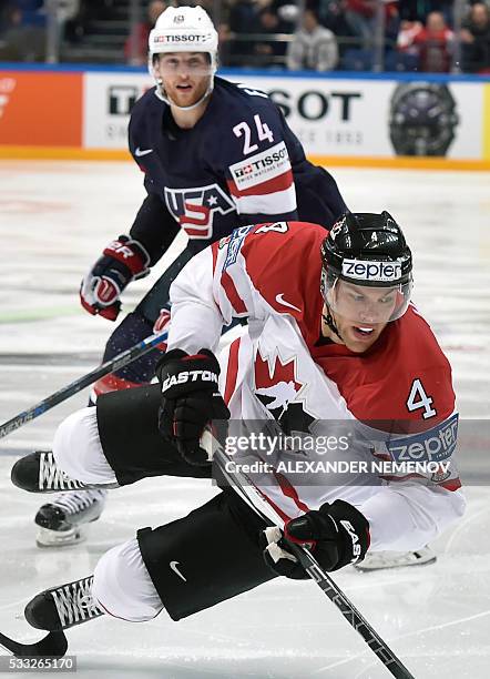 Canada's forward Taylor Hall vies with US forward Hudson Fasching during the semifinal game Canada vs USA at the 2016 IIHF Ice Hockey World...