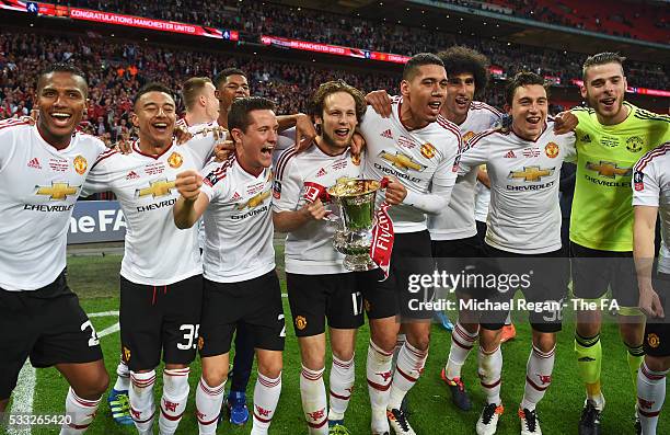 Manchester United players celebrate with the FA Cup Trophy after winning The Emirates FA Cup Final match between Manchester United and Crystal Palace...