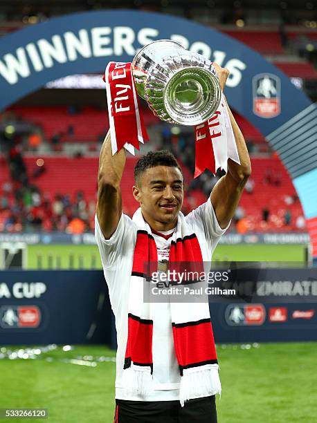 Winning goalscorer Jesse Lingard of Manchester United celebrates with the trophy after winning The Emirates FA Cup Final match between Manchester...