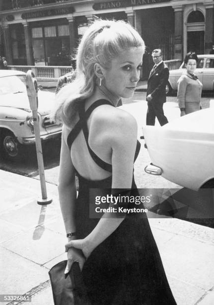 French film star Catherine Deneuve in London for the premiere of her new film 'Repulsion', a thriller directed by Roman Polanski, 10th June 1965.