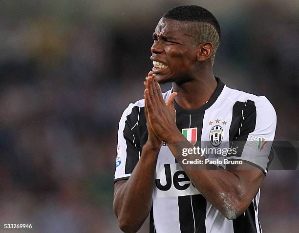 Paul Pogba of Juventus FC reacts during the TIM Cup final match between AC Milan and Juventus FC at Stadio Olimpico on May 21, 2016 in Rome, Italy.