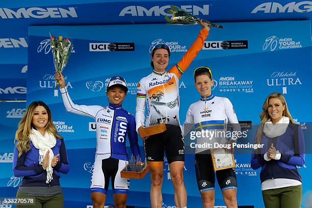 Marianne Vos of The Netherlands riding for Rabo-Liv Women Cycling Team takes the podium after winning stage three along with Coryn Rivera of the...