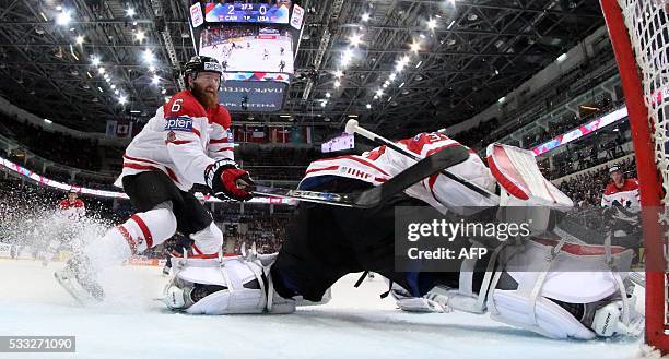 Canada's defender Ryan Ellis and Canada's goalie Cam Talbot try to save their net during the semifinal game Canada vs USA at the 2016 IIHF Ice Hockey...