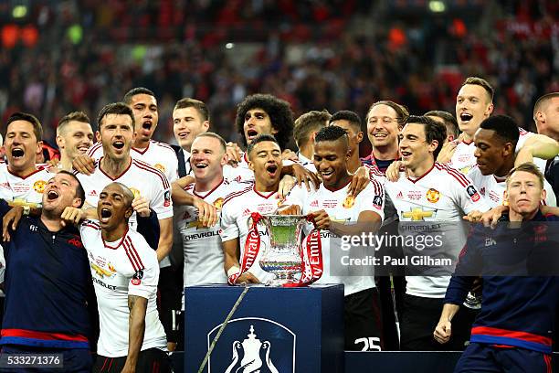 Manchester United players celebrate victory with the trophy after The Emirates FA Cup Final match between Manchester United and Crystal Palace at...