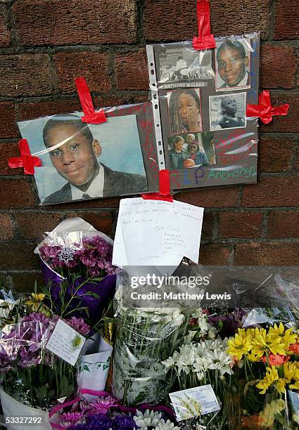 Floral tributes are laid at the scene where 18-year-old Anthony Walker died by McGoldrick Park, Huyton on August 5, 2005 in Merseyside, England....