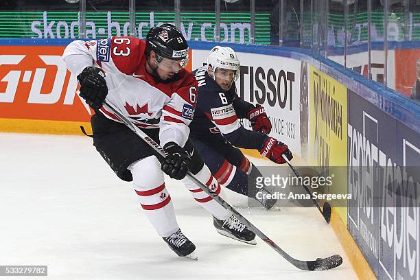 Brad Marchand of Canada and Chris Wideman of USA battle for the puck at Ice Palace on May 21, 2016 in Moscow, Russia.