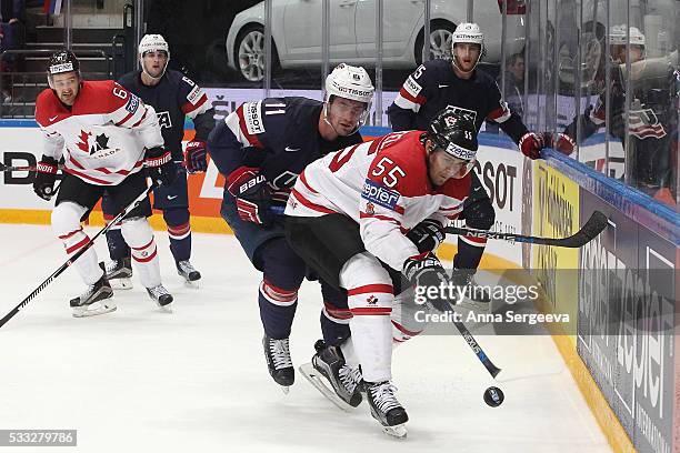 Mark Scheifele of Canada and Brock Nelson of USA battle for the puck at Ice Palace on May 21, 2016 in Moscow, Russia. Canada defeated USA 4-3.