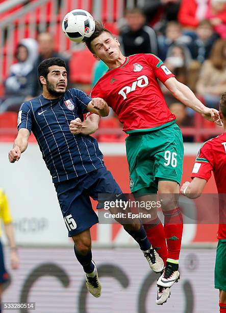 Rifat Zhemaletdinov of FC Lokomotiv Moscow challenged by Emin Makhmudov of FC Mordovia Saransk during the Russian Premier League match between FC...