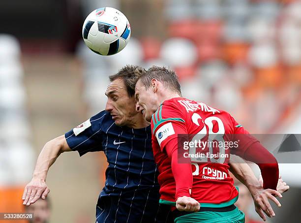 Jan Durica of FC Lokomotiv Moscow challenged by Ruslan Mukhametshin of FC Mordovia Saransk during the Russian Premier League match between FC...