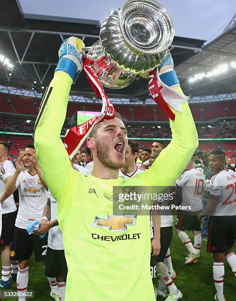 David de Gea of Manchester United celebrates with the FA Cup trophy after The Emirates FA Cup final match between Manchester United and Crystal...