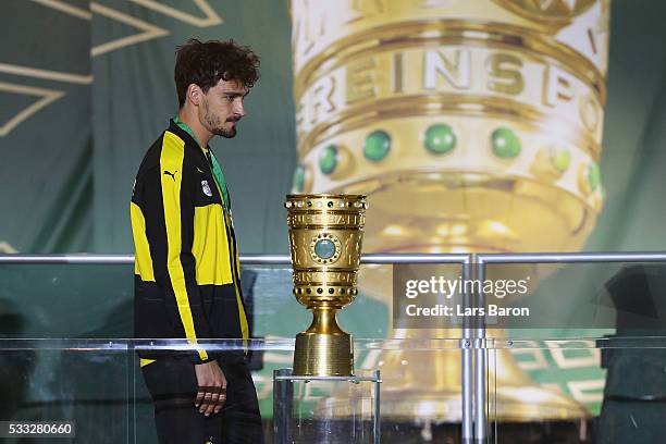 Mats Hummels of Borussia Dortmund looks dejected after receiving his medal and loosing the DFB Cup Final against Bayern Muenchen at Olympiastadion on...