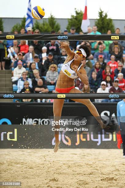 Xinyi Xia of China hits the ball over the net during the Gold medal match against Kerri Walsh Jennings and April Ross of the USA during day 5 of the...