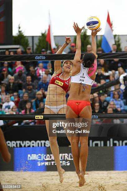 Chen Xue of China blocks a spike by Kerri Walsh Jennings of the USA during the Gold medal match during day 5 of the 2016 AVP Cincinnati Open on May...