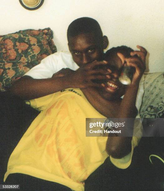 In this undated family handout photograph, Anthony Walker is seen in yellow top, August 5 Liverpool, England. Anthony Walker died from axe injuries...