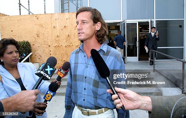 Defendant Matthew Hooker talks to the press after leaving the Santa Monica Couthouse where he appeared on stalking charges for pursuing actress...