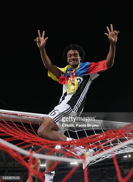 Juan Cuadrado of Juventus FC celebrates after winning the TIM Cup final match against AC Milan at Stadio Olimpico on May 21, 2016 in Rome, Italy.