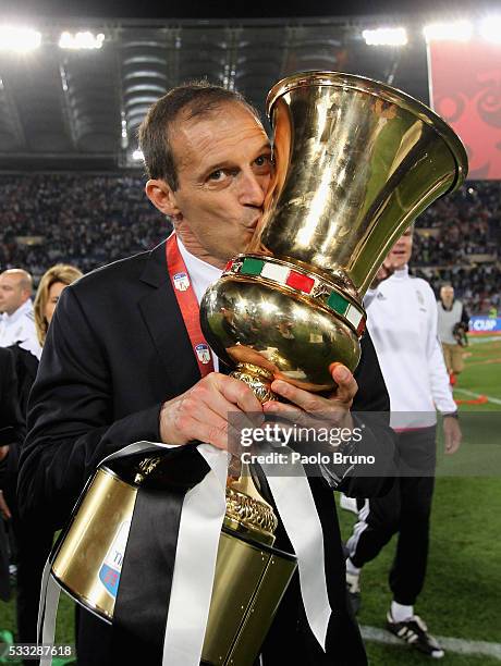 Juventus FC head coach Massimiliano Allegri celebrates with the trophy after winning the TIM Cup final match against AC Milan at Stadio Olimpico on...