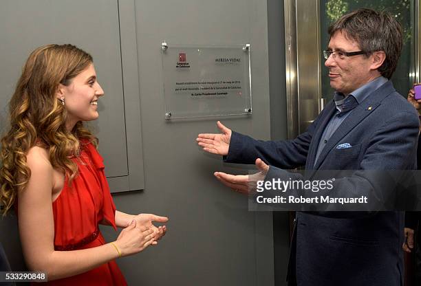 President of Catalunya Carles Puigdemont and Mireia Vidal attend the inauguration of the new store of Mireia Vidal Bridal on May 21, 2016 in...