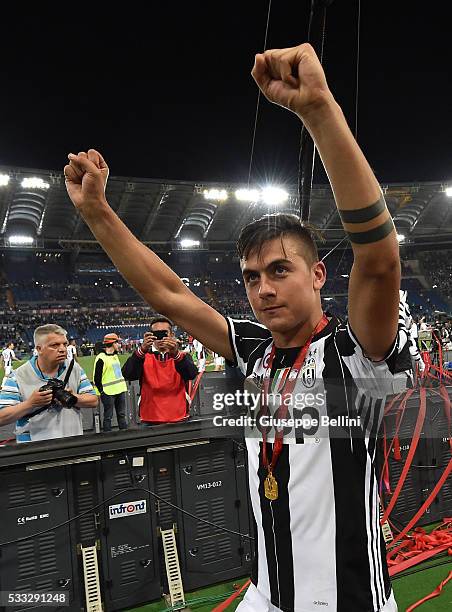 Paulo Dybala of Juventus FC celebrates the victory after the TIM Cup match between AC Milan and Juventus FC at Stadio Olimpico on May 21, 2016 in...