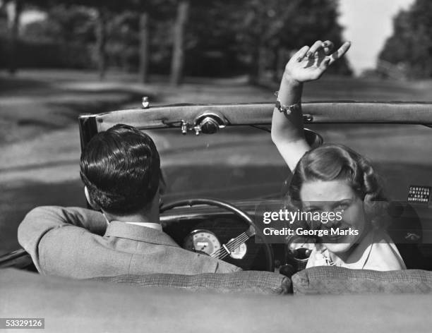 couple driving in convertible - woman-driving-car-1950s stock pictures, royalty-free photos & images
