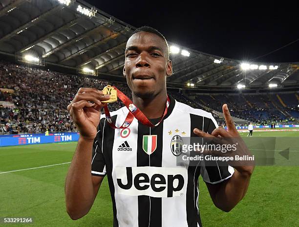 Paul Pogba of Juventus FC celebrates the victory after the TIM Cup match between AC Milan and Juventus FC at Stadio Olimpico on May 21, 2016 in Rome,...