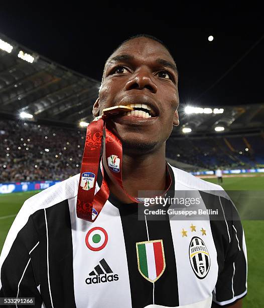 Paul Pogba of Juventus FC celebrates the victory after the TIM Cup match between AC Milan and Juventus FC at Stadio Olimpico on May 21, 2016 in Rome,...