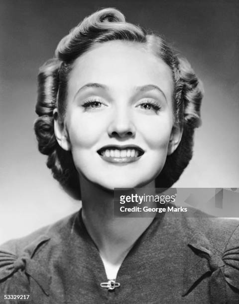 portrait of smiling woman - woman 1950 stock pictures, royalty-free photos & images
