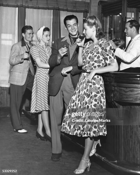 socializing at a bar - 50s bar stock pictures, royalty-free photos & images