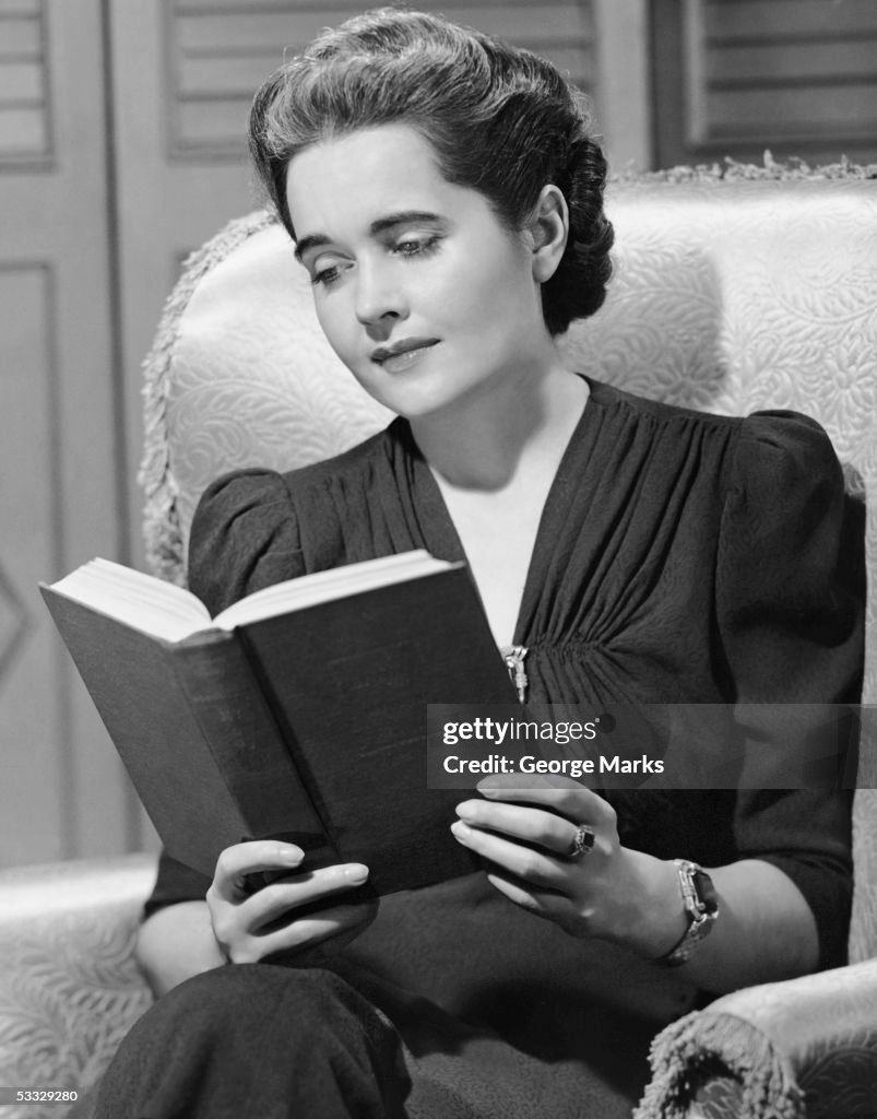 Portrait of woman reading indoors