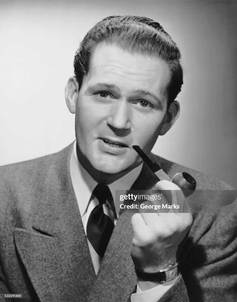 Portrait of man smoking pipe