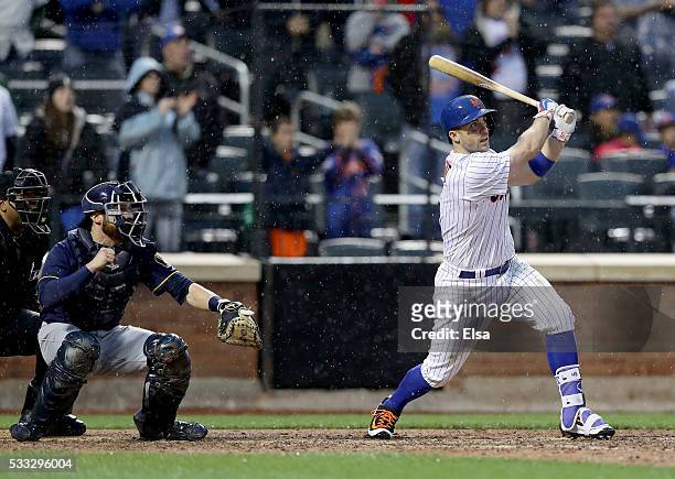 David Wright of the New York Mets hits a walk off single to win the game as Jonathan Lucroy of the Milwaukee Brewers defends in the ninth inning at...
