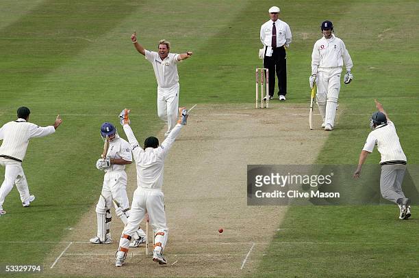 Shane Warne of Australia celebrates taking the wicket of Andrew Strauss of England during day two of the second npower Ashes Test match between...