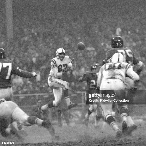 Receiver Raymond Berry of the Baltimore Colts catches a pass during the NFL Championship game against the New York Giants on December 28, 1958 at...