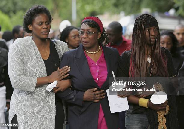 Mother of 18-year-old Anthony Walker, Gee Walker is consoled during a candlelit procession from St.Gabriel's church in Hall Lane to McGoldrick Park,...