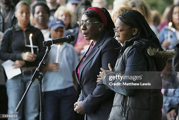 Mother of 18-year-old Anthony Walker, Gee Walker is consoled as she speaks to the hundreds of people during a candlelit procession from St.Gabriel's...