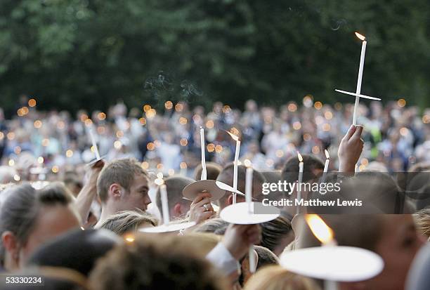 Hundreds of people gather during the candlelit procession from St.Gabriel's church in Hall Lane to McGoldrick Park to pay their respects at the scene...